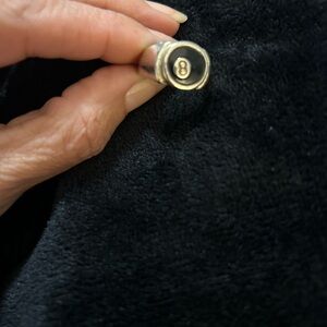 Silver unisex ring w/ a black 8ball on front- I think a size 8 but not 100%